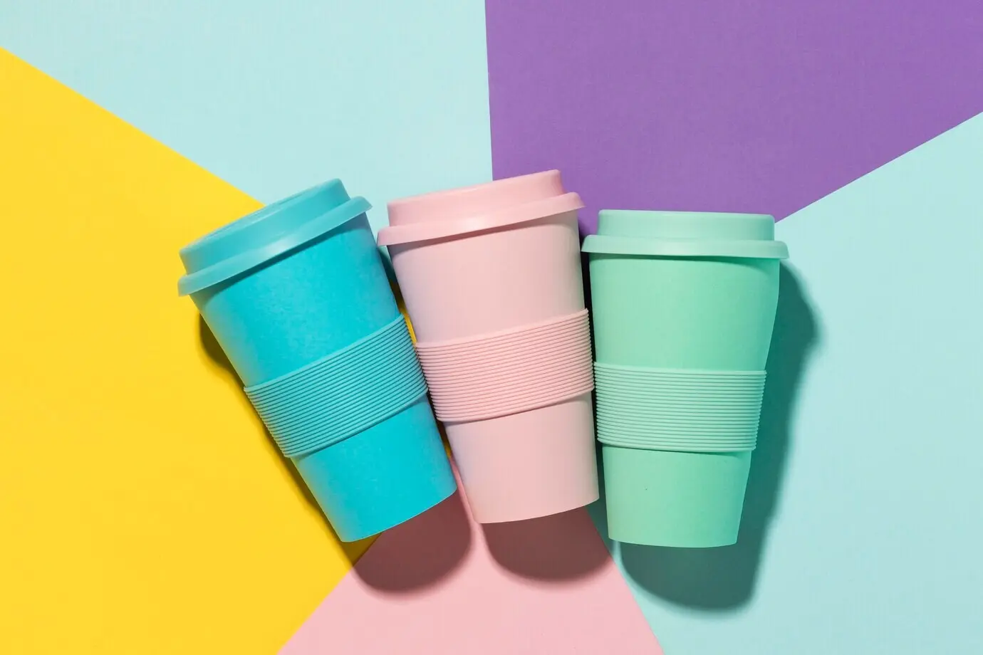 Top-down view of colored reusable cups on the table
